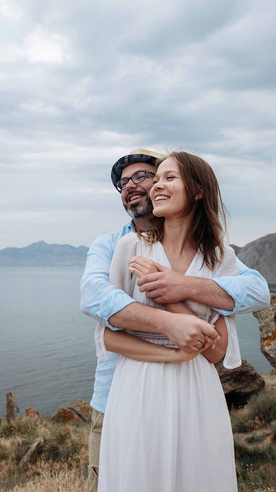 Couple embracing on a cliffside